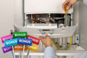 uomo lavora in una caldaia e la scritta bonus con bandierine