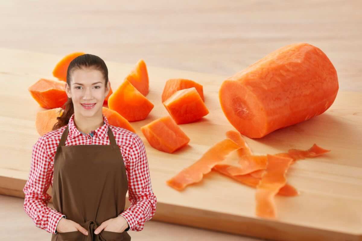 Carote sul tagliere, donna con grembiule da cucina
