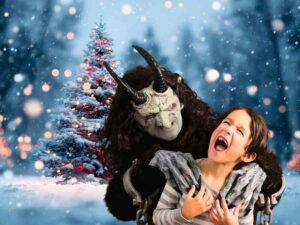 sfondo albero di Natale e Krampus che cattura bambino